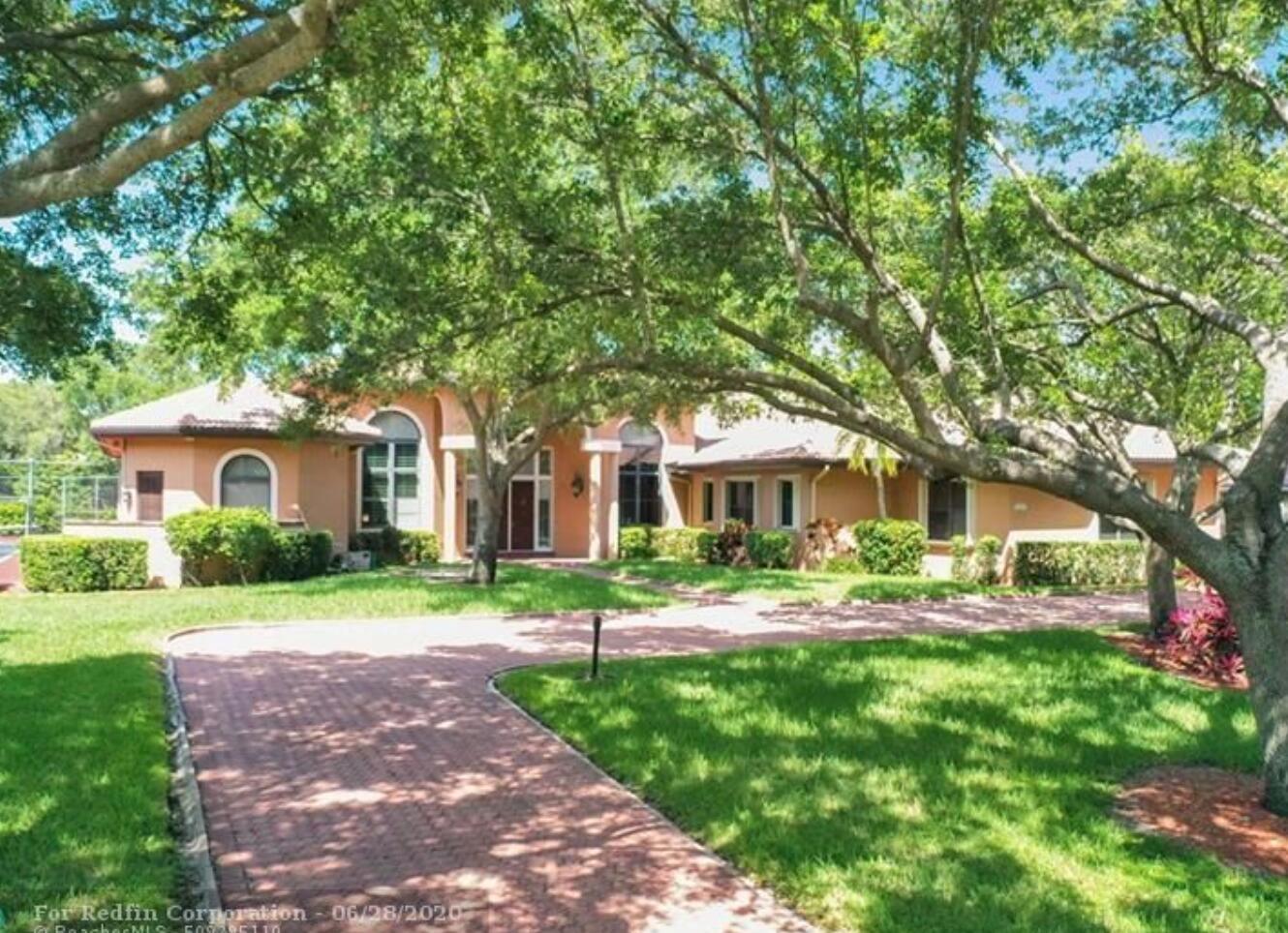 This stunning 5-bedroom, 6.5-bathroom lakefront estate offers over 5,300 square feet of luxurious living space on more than an acre of private, fenced land. The home is designed for seamless indoor-outdoor living -- featuring a heated pool, spa, built-in BBQ, and 201' of lake frontage.Inside, you'll find a chef's kitchen with custom cabinetry, kitchen island, wet bar, and central vacuum. High ceilings, a cozy fireplace, and a generous family room make the home ideal for both entertaining and day-to-day comfort. The main suite features its own sitting area and direct access to pool and spa.Smart features include impact windows/doors, storm shutters, and integrated security. This home is zoned RS‑1 and is not approved for sober living or group housing uses.