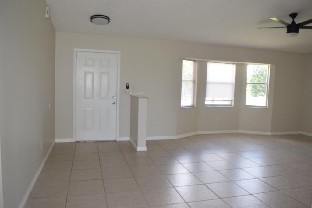 Photo of 702 SW Arkansas Terrace, Port Saint Lucie, FL 34953 (MLS # R11010013)
