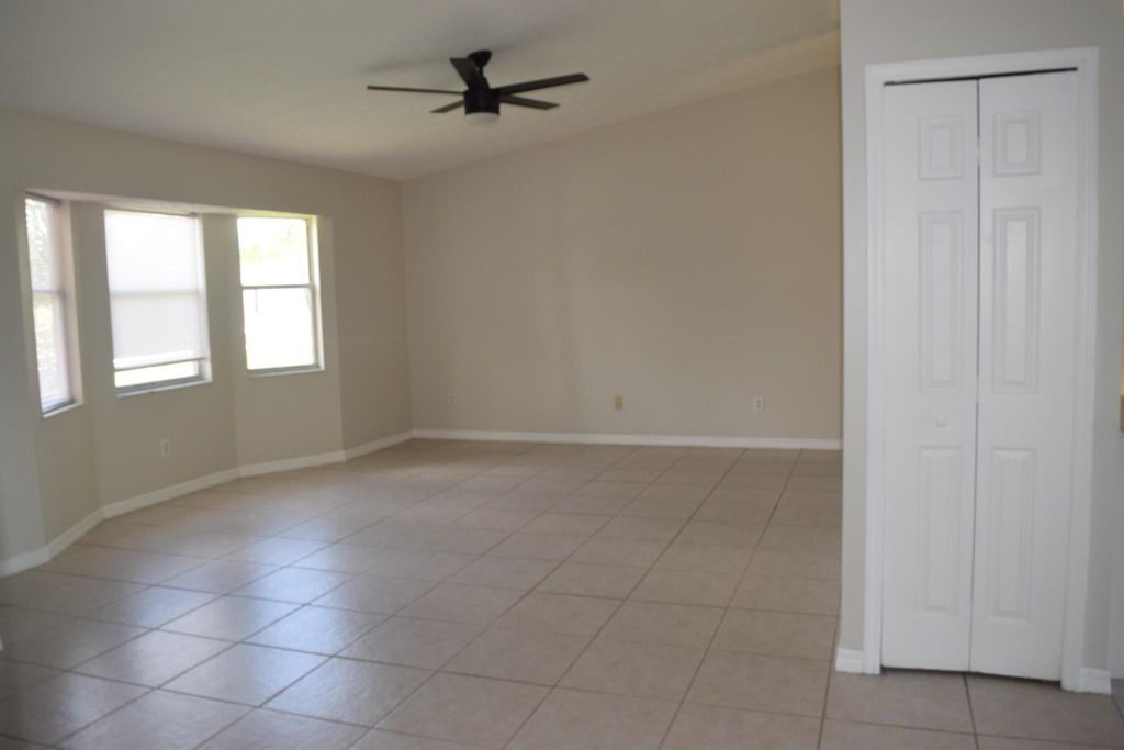 Photo of 702 SW Arkansas Terrace, Port Saint Lucie, FL 34953 (MLS # R11010013)