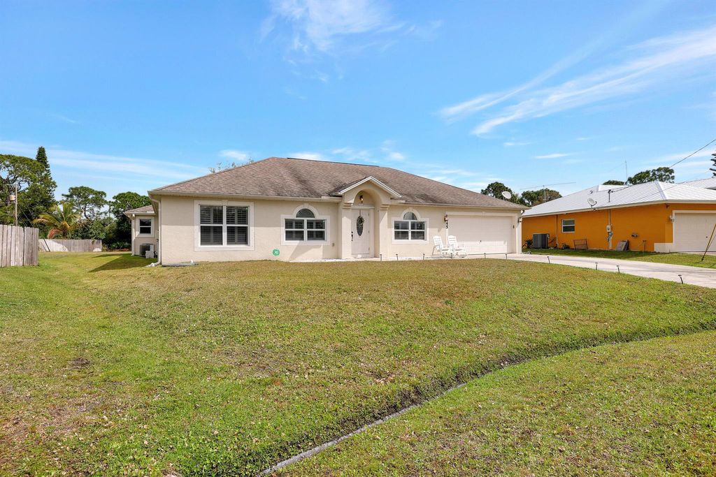 Photo of 2445 SW Falcon Circle, Port Saint Lucie, FL 34953 (MLS # R10967741)