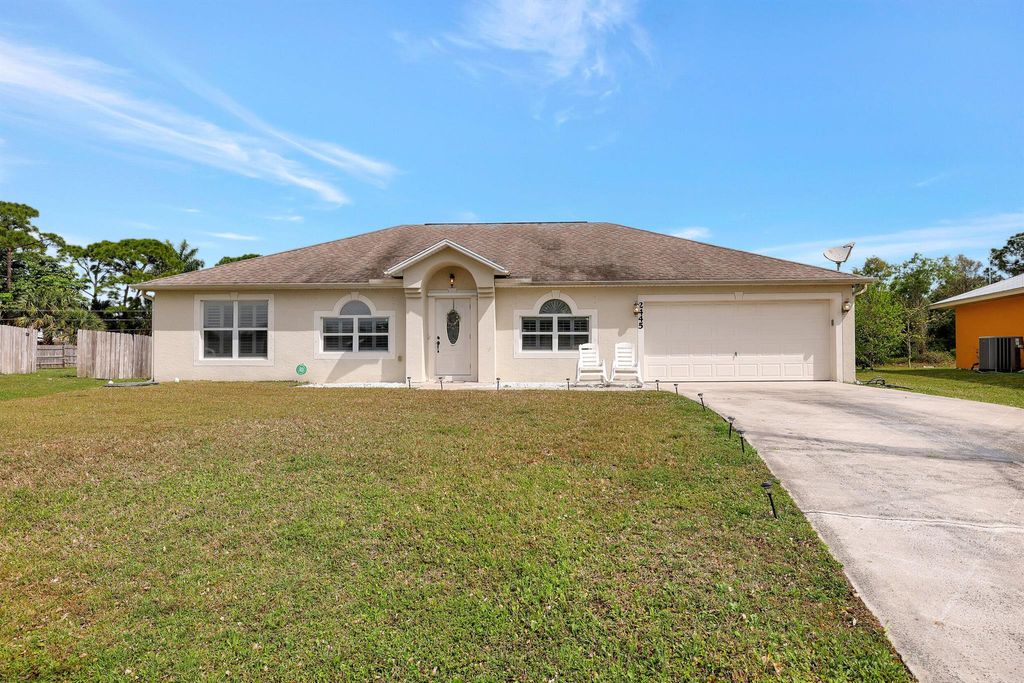Photo of 2445 SW Falcon Circle, Port Saint Lucie, FL 34953 (MLS # R10967741)