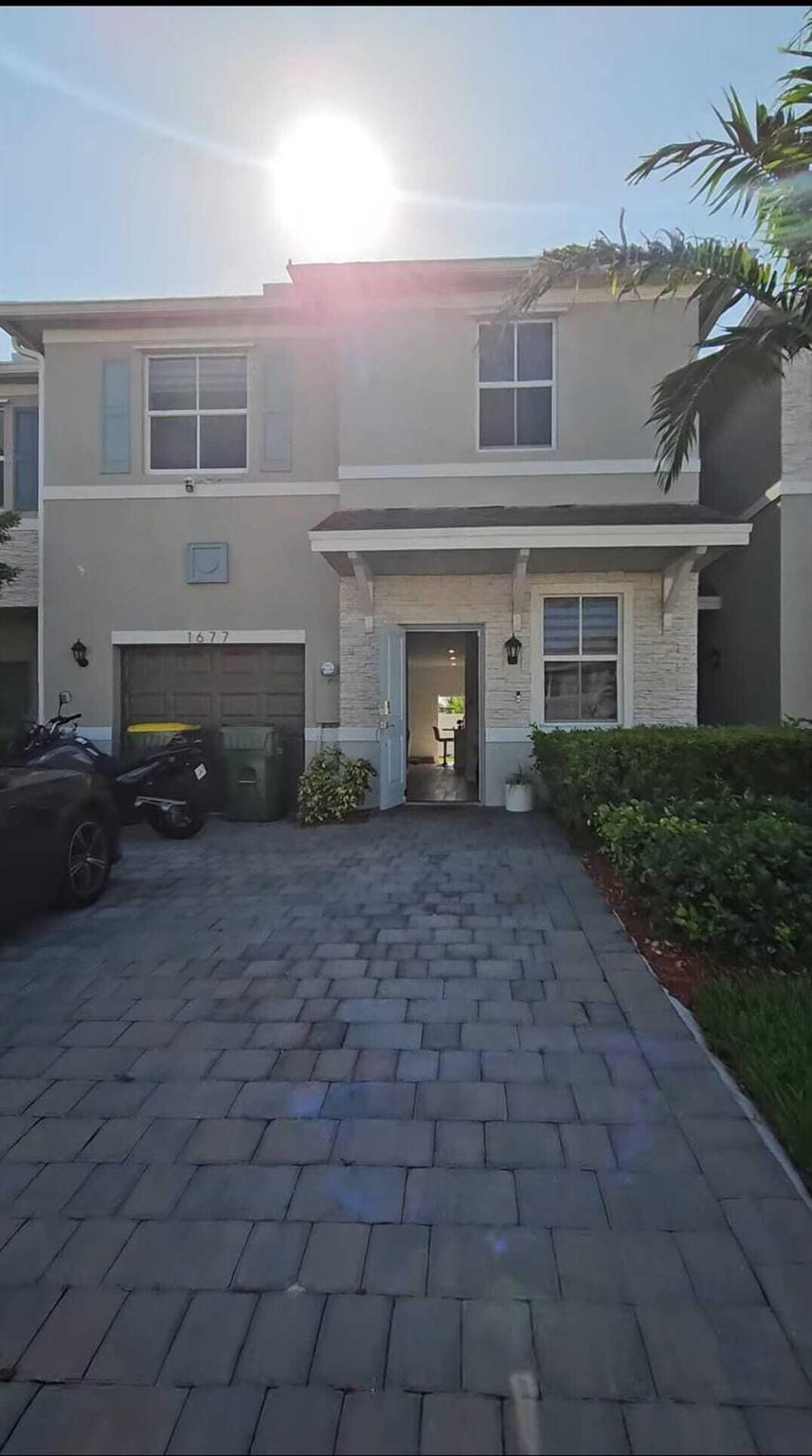 Step into nearly-new luxury with this stunning 4-bedroom, 2.5-bath with a 1 car garage townhouse built in 2022 by D.R. Horton--still under builder warranties for peace of mind! FURNITURE NEGOITABLE! Tucked inside a beautifully maintained community in Homestead, this smart home offers the perfect balance of comfort, style, and security. All four generously sized bedrooms are upstairs, including a spacious master suite with a private bath and oversized closet. The home features plush carpeting upstairs and sleek ceramic laminate flooring downstairs for a cozy yet modern touch.Enjoy a stylish open-concept kitchen complete with marble countertops and a built-in design perfect for entertaining.