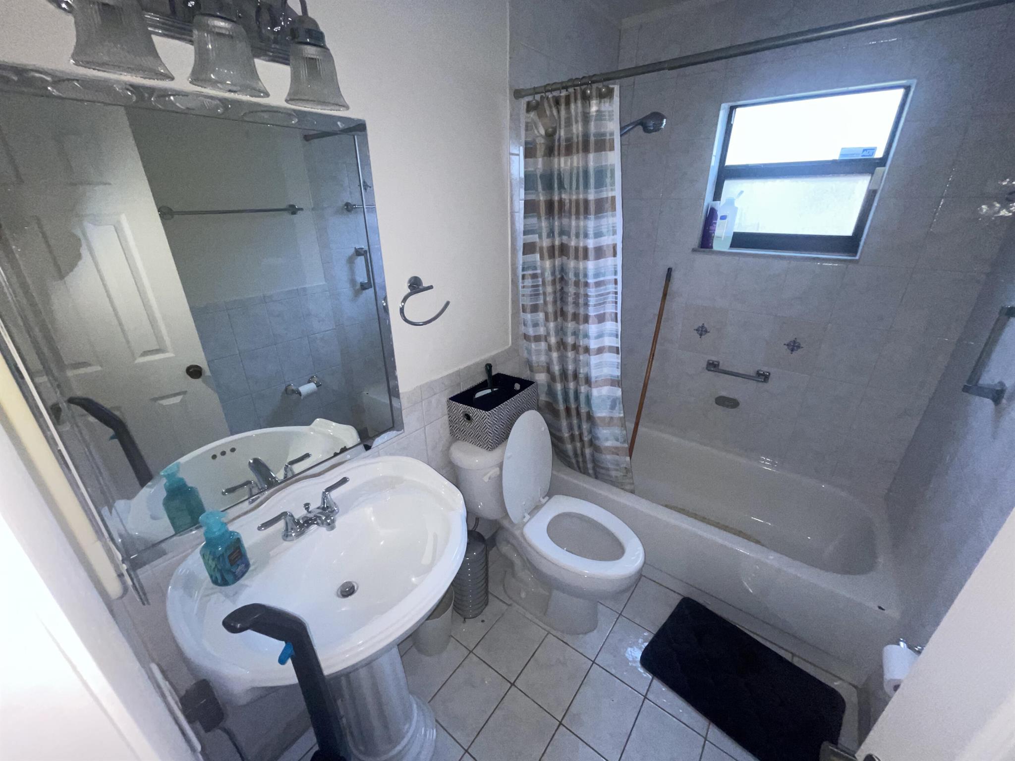 2 bed, 2 bath condo villa in central Pembroke Pines. Enjoy the spaciousness of high vaulted ceilings and an open layout, extending to a private screened-in patio terrace. Benefit from a recently installed 2023 roof. This property is offered as-is.