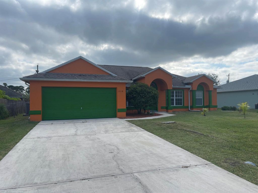 Photo of 1718 SW Desert Avenue, Port St Lucie, FL 34953 (MLS # R10932709)