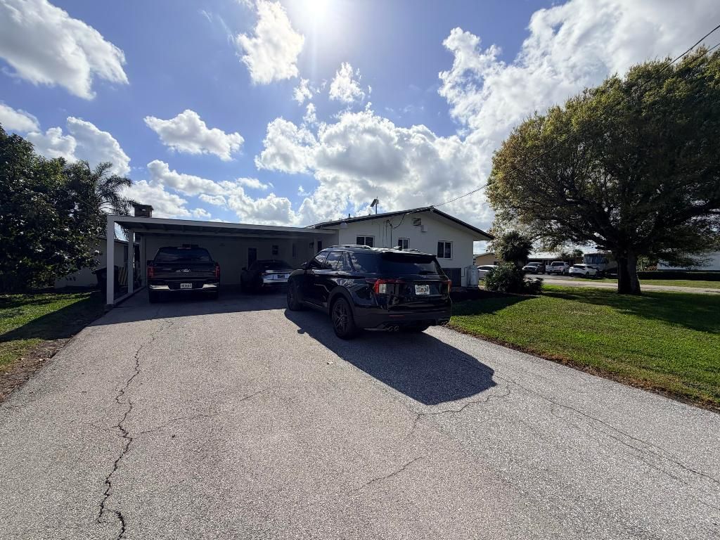 Photo of 955 NW 4th St, Belle Glade, FL 33430 (MLS # R11158700)