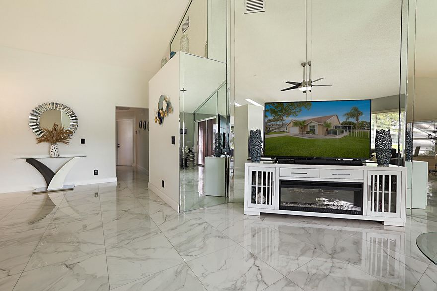 Welcome to this beautifully updated 3-bedroom, 2-bath home with a spacious 2-car garage, located in a highly desirable 55+ community offering resort-style amenities and a serene lakeside setting. This move-in-ready residence has been thoughtfully upgraded with a new roof (2021), A/C system (2022), water heater (2021), brand-new flooring throughout, fresh interior paint, new windows, and hurricane shutters for added peace of mind. Enjoy breathtaking lake views from both the living room and kitchen, creating a bright and tranquil atmosphere throughout the home. Relax and unwind in the screened lanai overlooking the water — the perfect place for morning coffee or evening sunsets.  The low-maintenance association fee of $320 month ($960/quarterly) and current assessment of $57.50 monthly ($172.50/quarterly) includes cable, internet, exterior home painting every 8 years, pressure washing every 4 years, pest control 3X per year, common area maintenance, and access to outstanding community amenities including: 2 swimming pools Pickleball courts Tennis courts Clubhouse and social activities Conveniently located just 10 minutes from Delray Medical Center, as well as shopping centers, dining, and entertainment, this home offers the perfect blend of comfort, convenience, and active adult living.  Don't miss the opportunity to own this charming waterfront home in one of the area's most welcoming and vibrant communities!