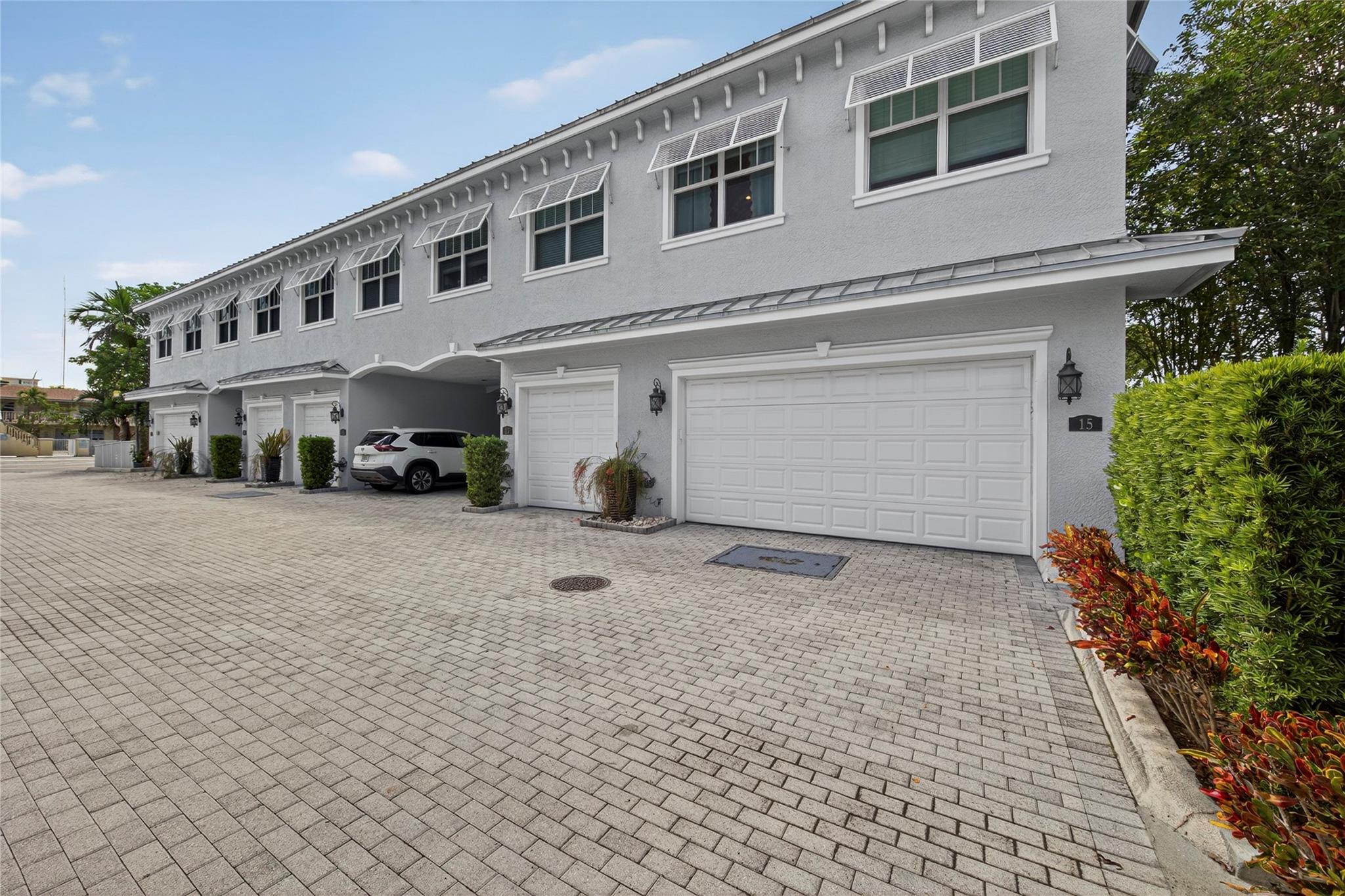 Don’t miss this stylish corner-unit townhouse in east Pompano Beach! Offering 3 bedrooms, 2.5 baths and a 2-car garage, the home features soaring 10’ ceilings, impact windows, and abundant natural light. The open layout boasts a spacious living, dining, and kitchen area, perfect for gatherings. The brand-new kitchen includes quartz counters, white oak cabinets, stainless appliances, and sleek finishes. A private paved patio adds space to relax or entertain. Upstairs, find laundry, a generous primary suite with four closets including a walk-in, plus two additional bedrooms and a bath. Updated with luxury vinyl flooring & freshly painted this home is move-in ready. Just 1 mile from the beach with easy access to dining, shopping, and more!