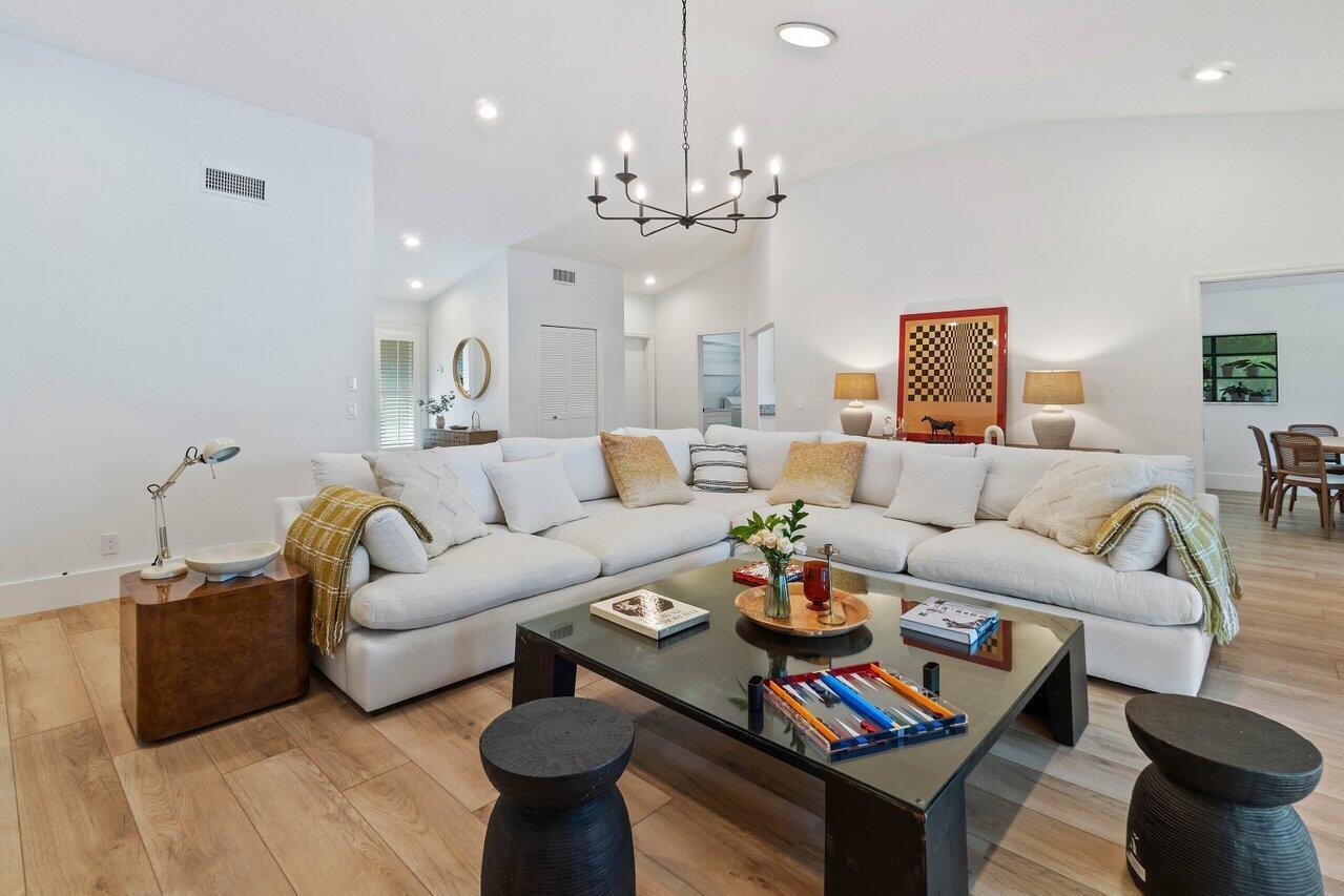 Available for the season at $8,500 per month and for the off season or annual rental at $5,000 per month. This 3-bedroom pool home was recently renovated and furnished with impeccable style and meticulous attention to details. Its warm and inviting ambiance makes you feel right at home. You can enjoy breathtaking water views from the spacious and comfortable sectional sofa in the living room, which also boasts a large flatscreen TV for quality time with family and friends. The open kitchen seamlessly connects to a sunlit dining space, perfect for hosting gatherings, featuring a generous wooden dining table with a view of the pool area. This turnkey property is situated less than 8 minutes from all equestrian venues.
