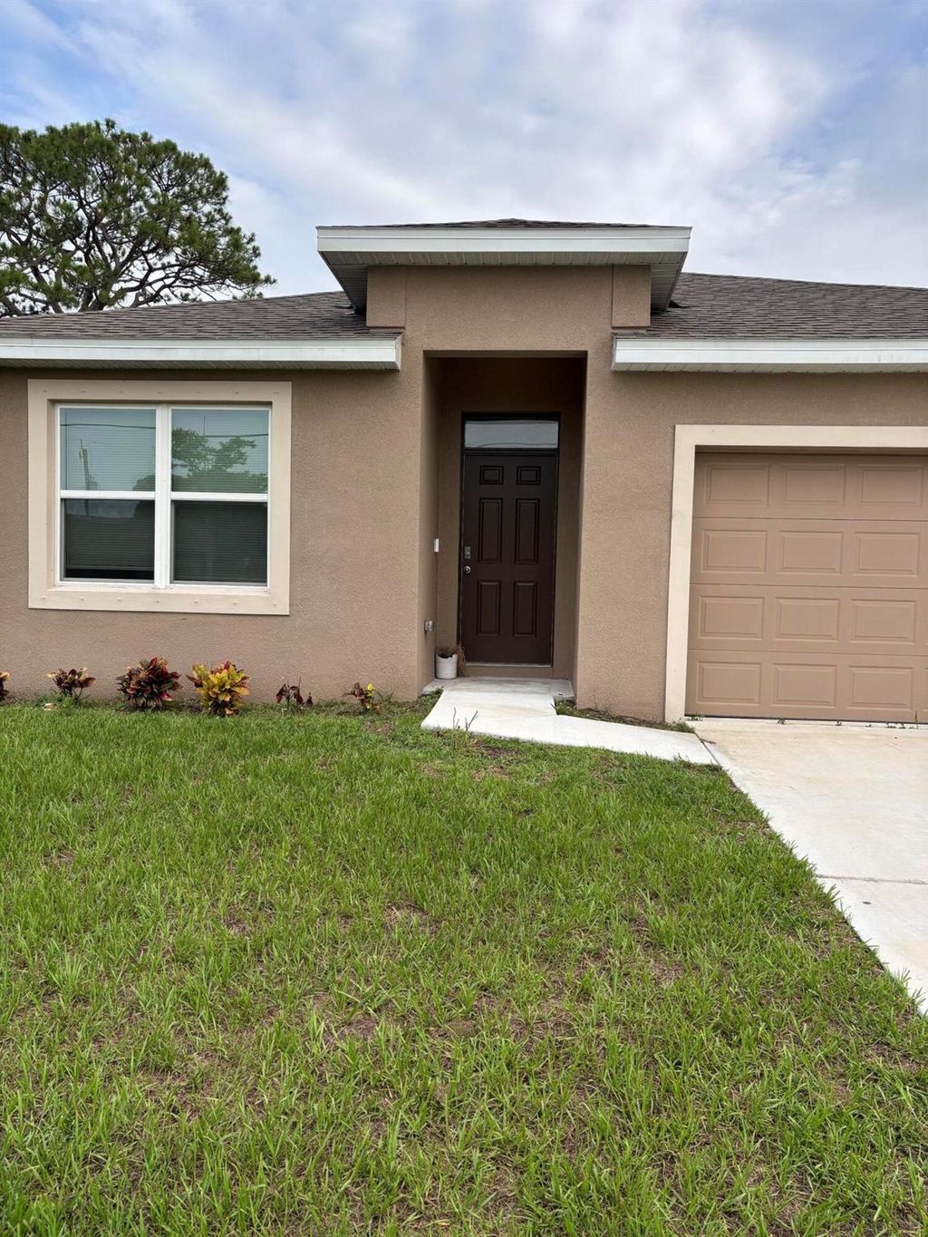 Photo of 684 NW Treemont Avenue, Port Saint Lucie, FL 34983 (MLS # R11097363)