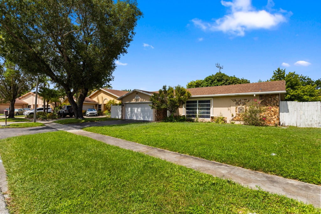 Photo of 3750 NW 73rd Avenue, Lauderhill, FL 33319 (MLS # B26065398)