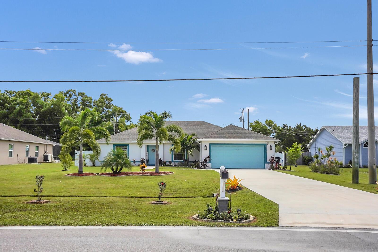 This beautifully maintained, move-in-ready 2021-built home offers the perfect combination of modern style, spacious design, and freedom--located in a highly desirable non-HOA neighborhood just 10 minutes to Jensen Beach, 10 minutes to Downtown Stuart, with easy access to US-1, shopping, and restaurants.Step inside to a bright, open-concept layout with vaulted ceilings, upgraded countertops, and stylish finishes throughout. The heart of the home is a spacious great room that flows into a gourmet kitchen with bar seating and modern finishes--ideal for entertaining.