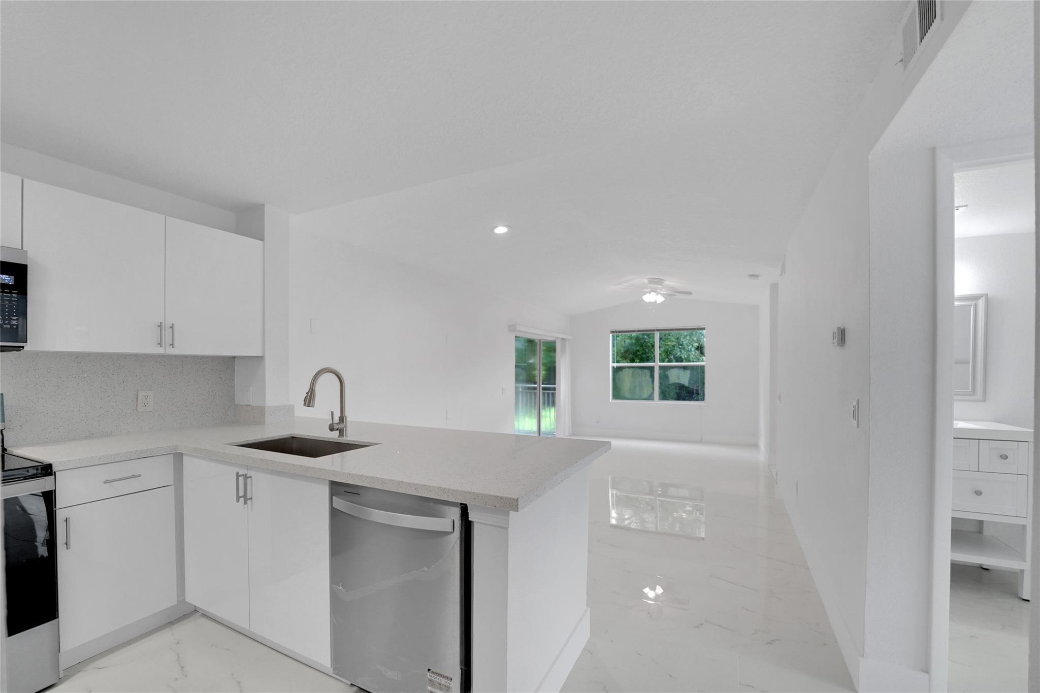 Stunning fully renovated 2-bedroom, 2-bath condo with a modern design and stylish finishes. Enjoy a private outdoor balcony perfect for relaxing. Ideally located near I-95, shopping, restaurants, and the lively Atlantic Avenue. Gated community with resort-style amenities including pool, fitness center, and tennis courts. Condo association requires 600+ credit score. Enjoy a welcoming neighborhood.