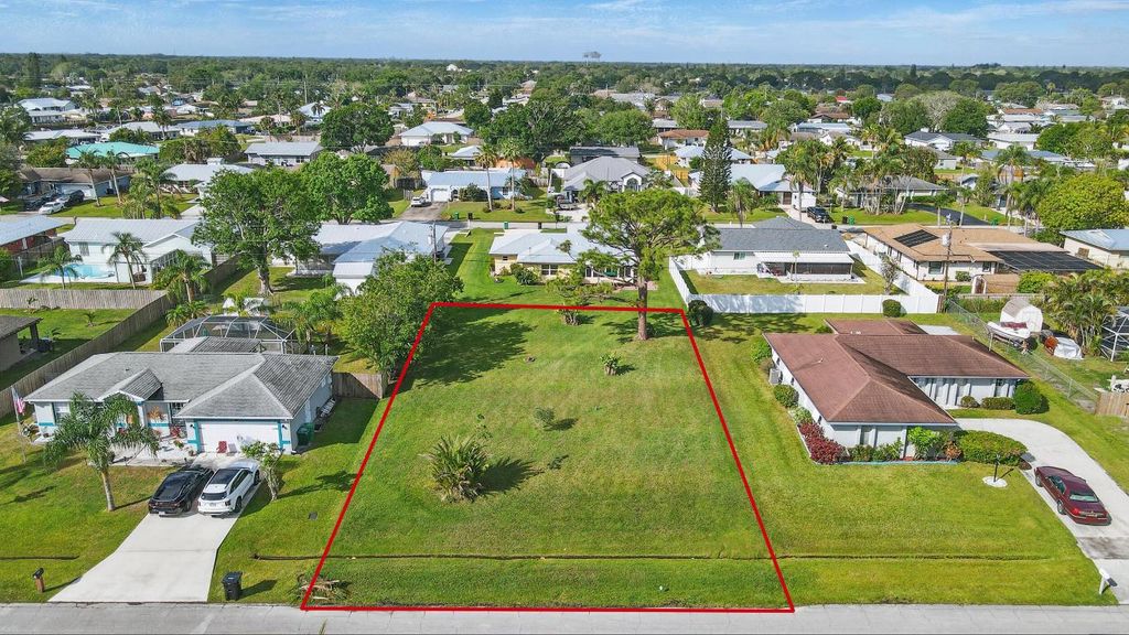 Photo of 440 SE Asbury Lane, Port Saint Lucie, FL 34983 (MLS # R11076827)