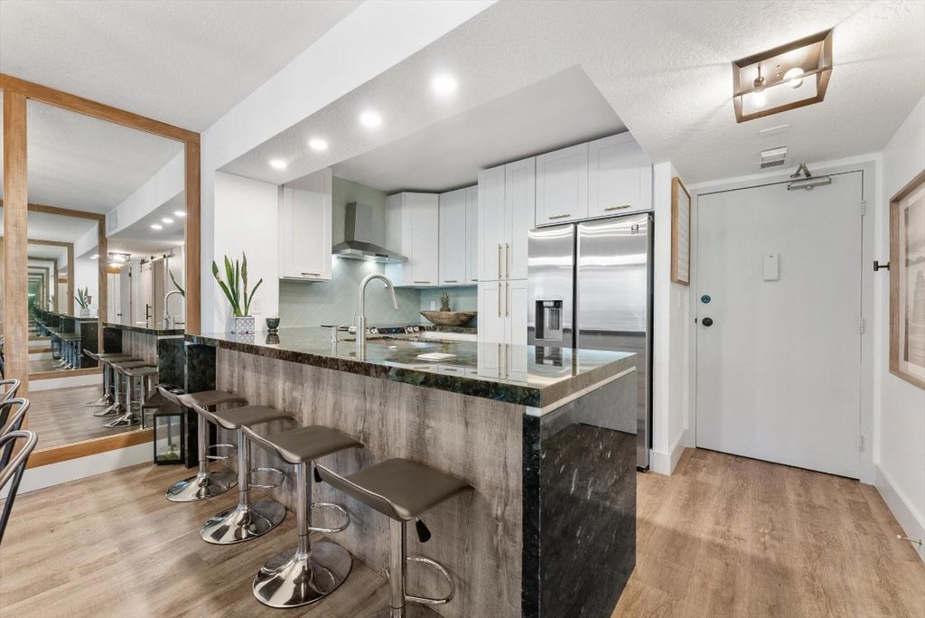 Photo of 3540 S Ocean Boulevard #211, South Palm Beach, FL 33480 (MLS # F10506703)