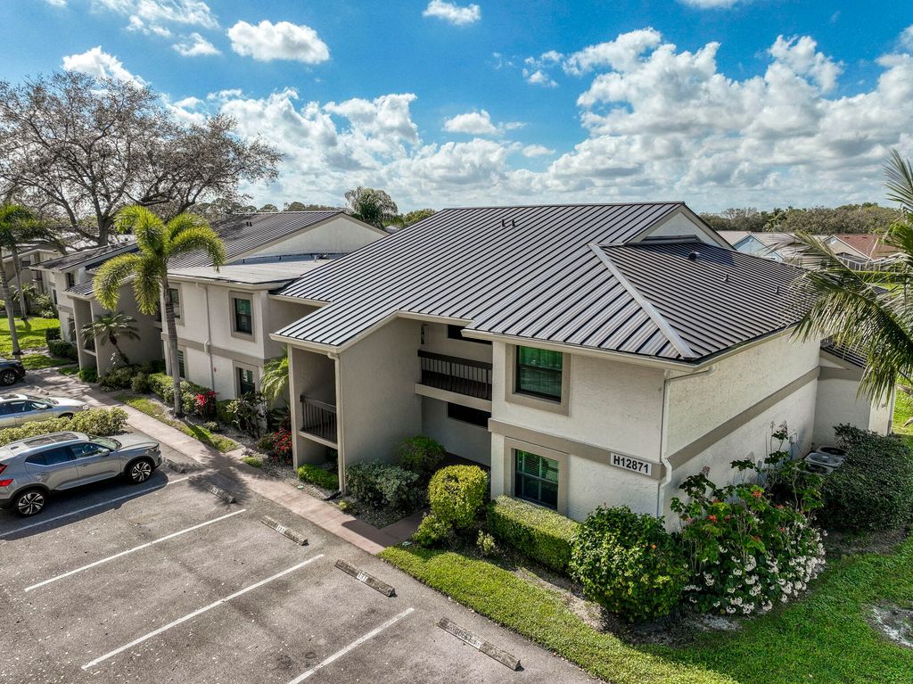 Photo of 12871 Briarlake Drive #204, Palm Beach Gardens, FL 33418 (MLS # R11160106)