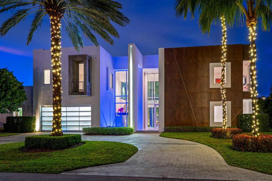 Steps from the beach, this estate, built in 2018, is designed with floor-to-ceiling impact glass for a light, bright ambience and a seamless connection to nature. An open floor plan configuration places the family room and kitchen adjacent to the pool and patio. Attractive features include a first-floor primary suite, a second-floor VIP suite, and guest bedroom that could serve as a club room. dramatic main gallery is enclosed in glass, offering serene views of the beautifully landscaped front yard and side gardens. In the main wing in an open-floor-plan configuration, the family room and dining room are open to the center-island chef's kitchen, finished with contemporary cabinetry, stainless-steel professional-grade appliances and a wall of sliding doors that lead to the loggia. Also in this wing are a guest bedroom suite with a private patio, a powder room and laundry. Set apart in a wing of its own is the stunning primary suite. It comprises a large bedroom with sliding doors that open to the side yard, two custom-fitted walk-in closets, and a magnificent stone-clad bathroom with dual sinks, a huge shower and a lounge tub. On the second floor in a split-bedroom plan, the VIP bedroom suite is placed separately from the other guest bedrooms. Also, this residence has easy beach access; it is integrated with Smart Home technology, and windows and doors throughout are impact-glass.  PROPERTY:  Across the street from the ocean on an oversized beautifully landscaped corner lot, the driveway circles around an oasis to the two-car garage and spectacular entry adjacent to a tranquil water feature. Inviting indoor/outdoor entertaining in the hedged back yard, the covered loggia, wrapped within an expansive deck, overlooks the 55-foot pool with a sun shelf and a stone feature wall with soothing fountain sprays. Additional amenities for easy living are the summer kitchen/barbeque area, easily accessible from the kitchen, and the outdoor shower, convenient when returning from the beach.  DISCLAIMER: Information published or otherwise provided by the listing company and its representatives including but not limited to prices, measurements, square footages, lot sizes, calculations, statistics, and videos are deemed reliable but are not guaranteed and are subject to errors, omissions or changes without notice. All such information should be independently verified by any prospective purchaser or seller. Parties should perform their own due diligence to verify such information prior to a sale or listing. Listing company expressly disclaims any warranty or representation regarding such information. Prices published are either list price, sold price, and/or last asking price. The listing company participates in the Multiple Listing Service and IDX. The properties published as listed and sold are not necessarily exclusive to listing company and may be listed or have sold with other members of the Multiple Listing Service. Transactions where listing company represented both buyers and sellers are calculated as two sales. "No payments made until title passes" Some affiliations may not be applicable to certain geographic areas. If your property is currently listed with another broker, please disregard any solicitation for services. Information published or otherwise provided by seller, listing company or its representatives is deemed reliable but are not guaranteed and subject to errors, omissions, or changes without notice. Copyright 2026 by the listing company. All Rights Reserved.