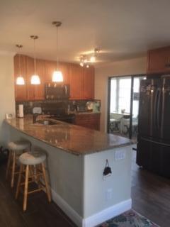 Totally renovated, luxurious, first floor 2/2 located in sought after Piedmont section! Living Rm/Dining Rm has golf and water view, patio has garden view. Wood look tile throughout, Crown Molding, Stunning Open Kitchen with Decorator Solid Wood Cabinets and Upgraded SS appliances. Beautifully renovated bathrooms. Hard to find DELUXE floor plan has master bath in the bedroom not the hall - and Huge walk-in closet in the Master bed. Slider from both Master Bed and Kitchen onto enclosed porch. Full size washer/dryer in laundry room on porch.GREAT NEIGHBORS! Enjoy a highly active community w renovated Clubhouses, 8 Pools, (including 3 INDOOR POOLS), Bistros, Gyms, Fitness Center, Personal Training Center, Spa, Card Rooms, Salon and more. Shows and Movies weekly. Two 18-hole Golf Courses
