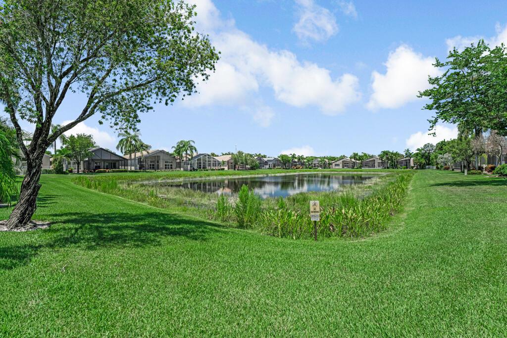 Beautiful Lake front much sought after home situated in the center of the most loved 55 plus super active community, known for its highly active sports and entertainment complex! This highly sought after floorpan boasts 3 beds, 2 1/2 baths & a peaceful, serene screened lanai overlooking the lake. No main roads, walk to both the social hall, & athletic center! 10 tennis, 6 pickleblall, 3 bocce crts, full time pro, 2 indoor racquetball crts too! A beauty salon, state of the art fitness center, massages,sauna, steam, full time social director, clubs, organizations, so much to do! Tropical social pool, resistance and lap pool, indoor whirlpool, more! Lightly lived in Mr and Mrs snowbird kept this home pristine! Furniture negotiable, make it your own and move right in! Priced low! LOVE IT!