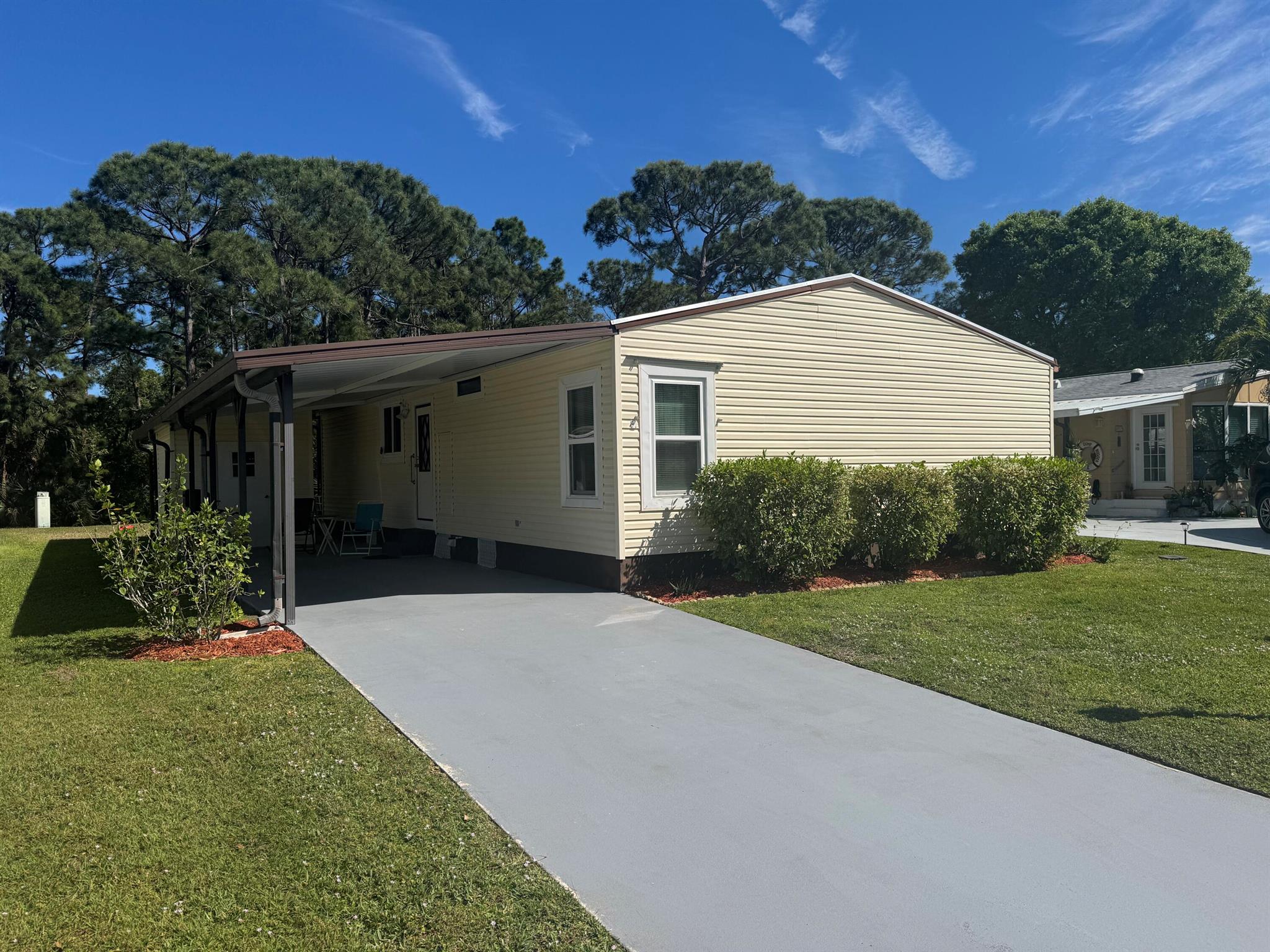 LAND OWNED!! Come see this spacious 2 BED 2 BATH home on a quiet cul-de-sac in Savannah Club! 2018 ROOF, 2015 AC! NEW IMPACT windows! Spacious ISLAND KITCHEN with large pantry! Tile and vinyl flooring throughout- NO CARPET! Open floorplan living & dining area. Covered carport with separate storage room. Huge enclosed patio with beautiful preserve view! Why pay for a land lease, when you can own your land? Schedule your private tour today!
