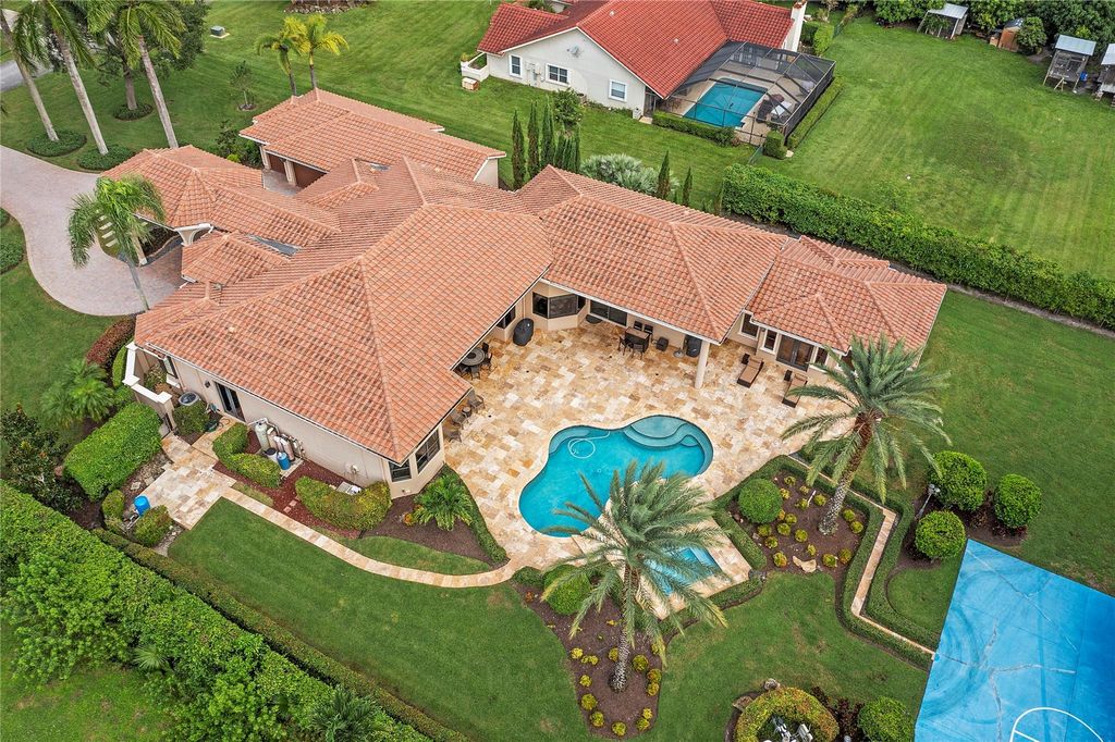 Photo of 7092 NW 65th Te Ter, Parkland, FL 33067 (MLS # F10405023)