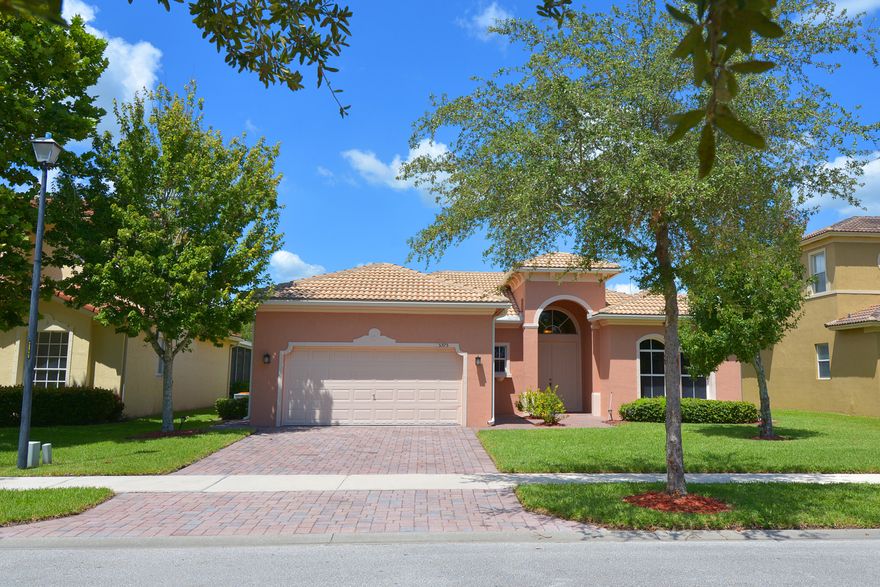 Beautifully maintained home with 3 bedrooms, 2 bathrooms, and a 2 car garage,  Living room and Dining room along with an eat in kitchen with snack bar.Modern appliances (new microwave & stove).  Enclosed lanai provides a comfortable place to watch the sunset.  Custom brick paver walkways surround this home.  Fresh paint inside & out.  Don't wait this home will not be on the market for long.