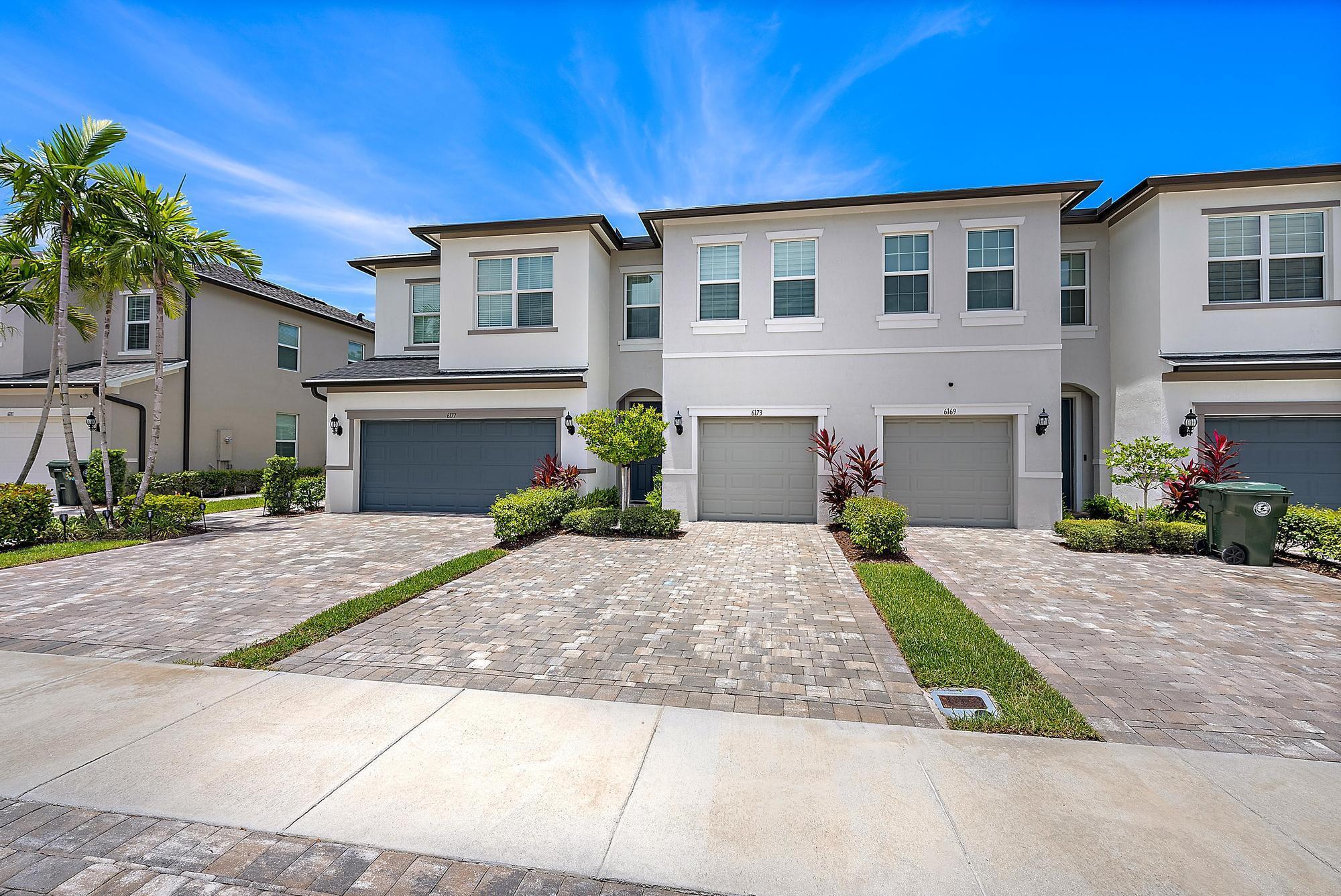 This beautifully townhouse, built in 2023, offers modern living at its finest. Nestled in the desirable Ranchette Square community, this 3-bedroom, 2.5-bath home boasts a spacious open-concept design and luxurious builder upgrades throughout. The main floor features sleek, modern finishes, with custom 8-foot doors and hurricane-impact windows and doors for ultimate peace of mind. Upstairs, you'll find gorgeous new vinyl flooring, offering a fresh, stylish upgrade. The spacious kitchen comes with modern appliances and ample counter space, perfect for cooking and entertaining. With a fenced-in backyard, this home is perfect for pets and children to play safely. The attached 1-car garage provides convenience, and the home's prime location makes it a commuter's dream, with easy access to