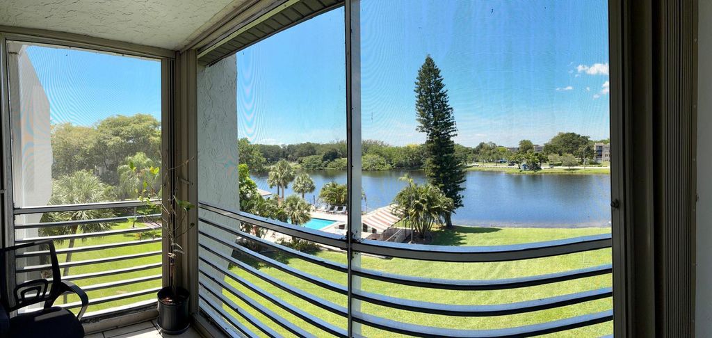 Photo of 9440 Poinciana Place #404, Davie, FL 33324 (MLS # B26028281)
