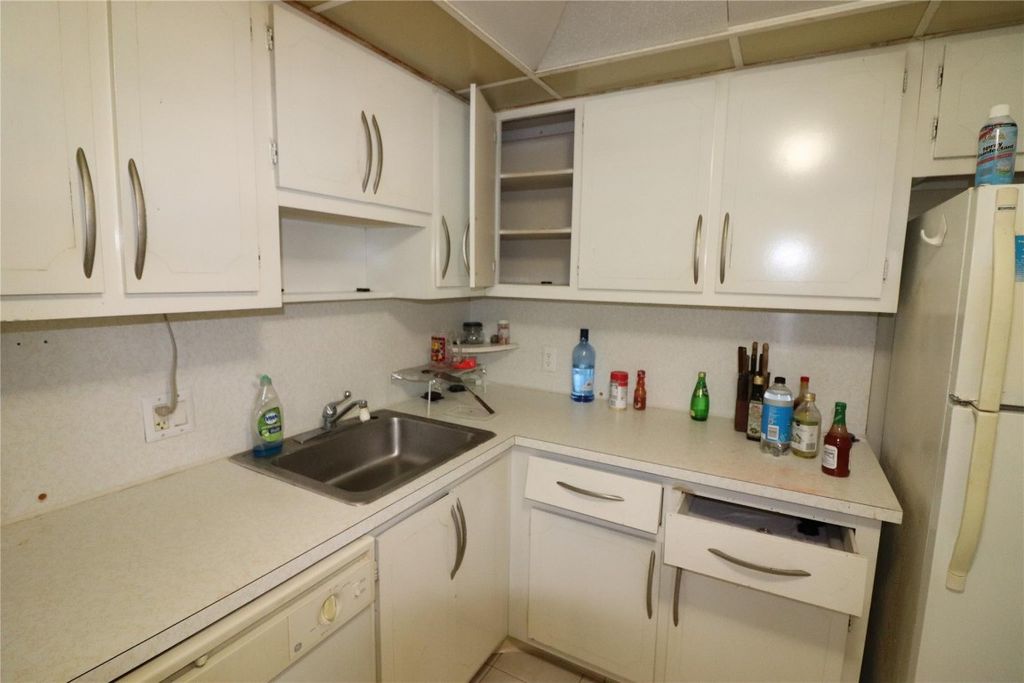 Photo of 2691 S Course Drive #207, Pompano Beach, FL 33069 (MLS # F10427510)