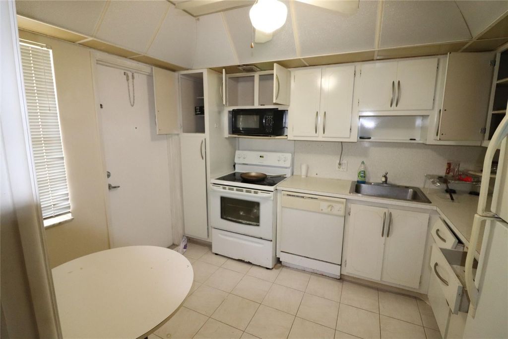 Photo of 2691 S Course Drive #207, Pompano Beach, FL 33069 (MLS # F10427510)