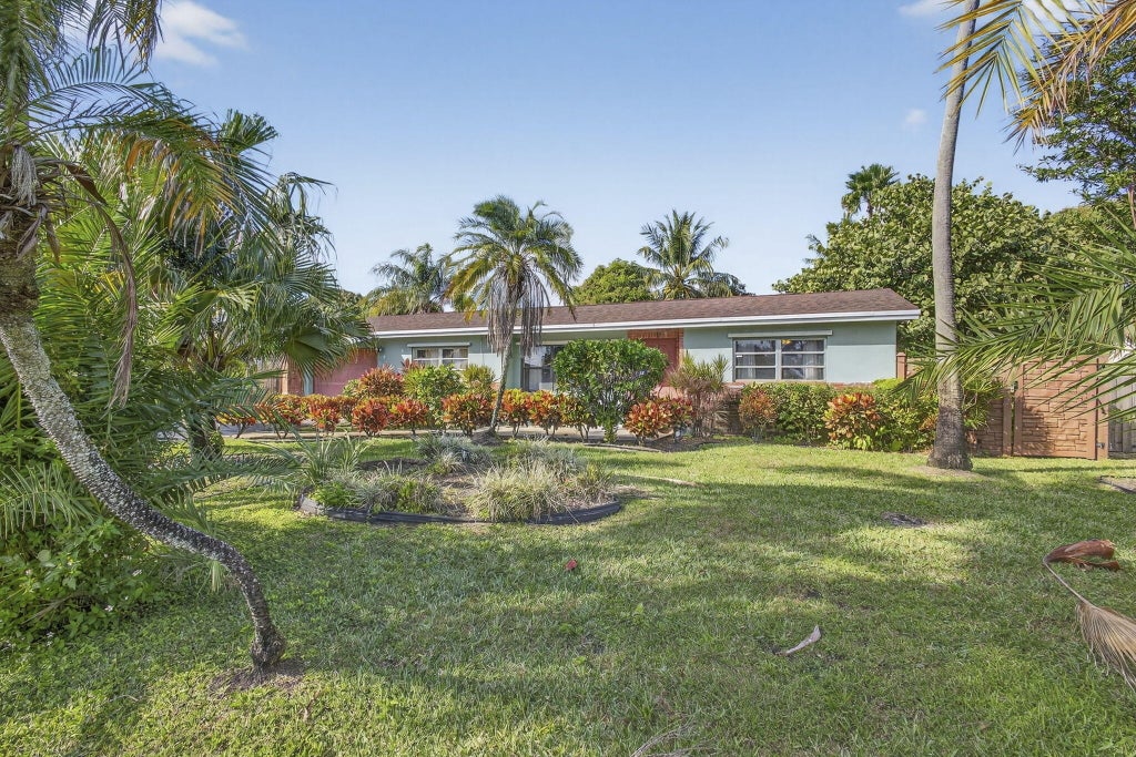 Photo of 729 W Kalmia Drive, Lake Park, FL 33403 (MLS # R11156290)