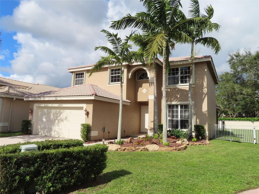 Brand new interior paint & new upstairs carpeting compliment the beautiful fixtures & finishes in this upgraded SFH. 4 bedrooms, 2.5 baths. Gated north Coral Springs community (Stoneman Douglas High School!). Wood cabinetry, granite counter tops, stainless steel appliances with brand new oven & range!  Tiled first floor. Opulent primary suite with lush oversized bath - double sink vanity, separate water closet, tub for two, and a giant shower with twin shower heads. Separate living & family rooms plus a vast screened & roofed porch that runs the length of the house. Relax or entertain rain or shine.  Out door bar, luxury hot tub, & margaritaville decor remain if tenants would enjoy or can be removed. Bring Fido - fenced yard & pet door. Accordion hurricane shutters! EZ to show!