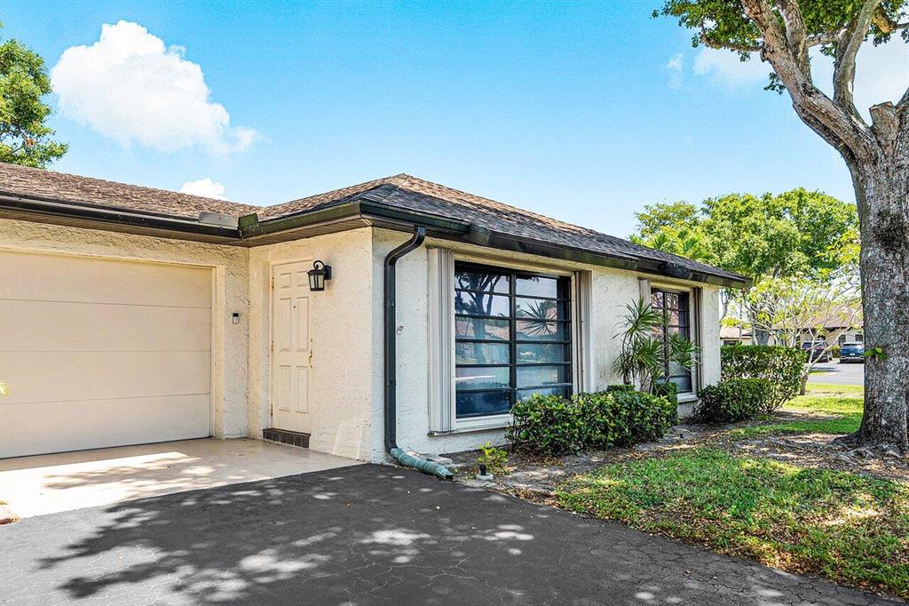 Walking distance to one of the 6 pools in community. Beautifull tile in main living area. Kitchen updated and both bathrooms have been updated. Accordion Shutters and an Updated Electrical Panel. This lovely villa is move in ready and can be purchased with most of the furniture. Community has 6 Intimate Clubhouses with a Pool at each. Assocation Dues include Water, Cable, Roof Maintenance, Exterior Building Maintenance, and Lawn Care. Close to Shopping, Restaurants and Medical. Also, not far to the Beach.