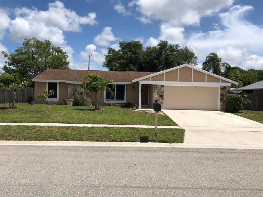 Photo of 124 Sherwood Drive, Royal Palm Beach, FL 33411 (MLS # R10723202)