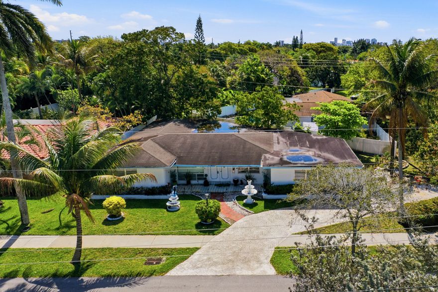 Handyman special with strong upside in Wilton Manors. This 3-bedroom, 2-bath home offers 2,057 sq ft under air on a 9,264 sq ft corner lot.  Circle driveway and oversized 2 garage.  Needs complete renovation.    Located in a high-demand area with continued redevelopment and price growth.