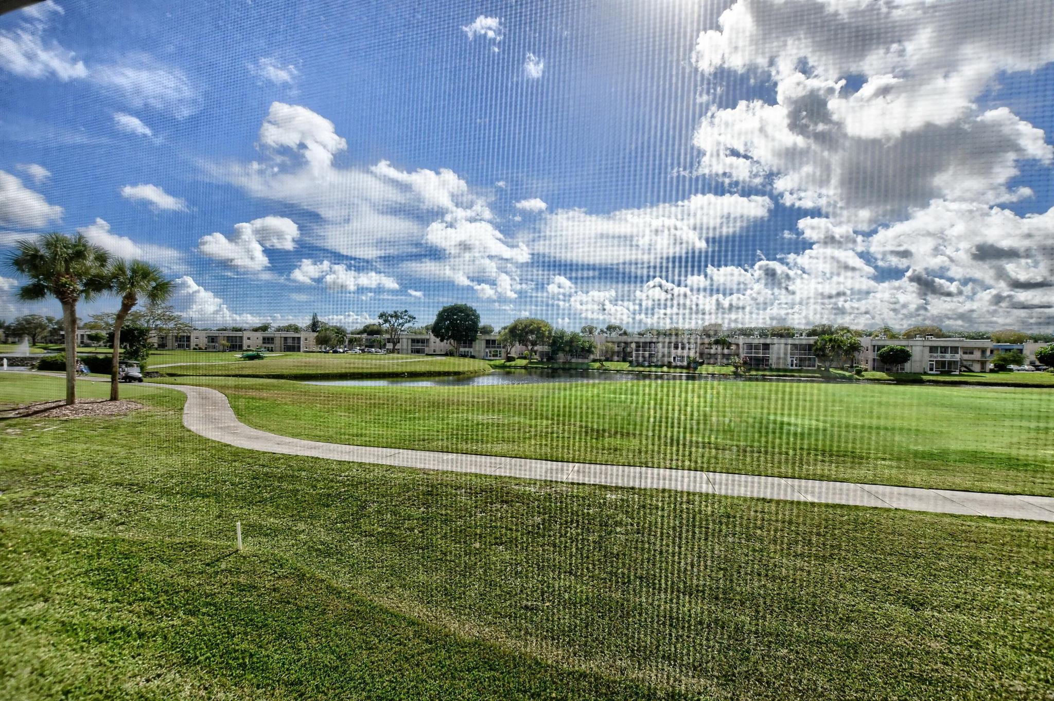 Luxury 2 Bed/2 Bath Condo, in the Isle of Capri ''E'', Area of Kings Point. with access by a Regular Size Elevator to the 2nd. Floor, with Panoramic Golf & Water Views from your 20' Screened Patio. Updated Kitchen W/Granite, Newer Double Range, Microwave, Dishwasher, Island, Bath's, W/2 Stall Showers, Tile Floors. Newer A/C, Freshly Painted. Kings Point is a very Socially Active 55+, Golf & Country Club Community, with Resort Style Amenities, 3 Clubhouses, 2 Golf Courses, In & Out Door Pools, 2 Restaurant Cafe's, 1200 Seat Theatre, with Live Shows, Movies, Clubs to enjoy. Fitness Gym's, Tennis, Billiards, Beauty Parlor, + more.. Free Transport. within the Comm. as well as many outside. KP is located 45 Mi from 2 Major Airports, 15 Min. from Historic Delray Beach & Atlantic Ave, Promenade.