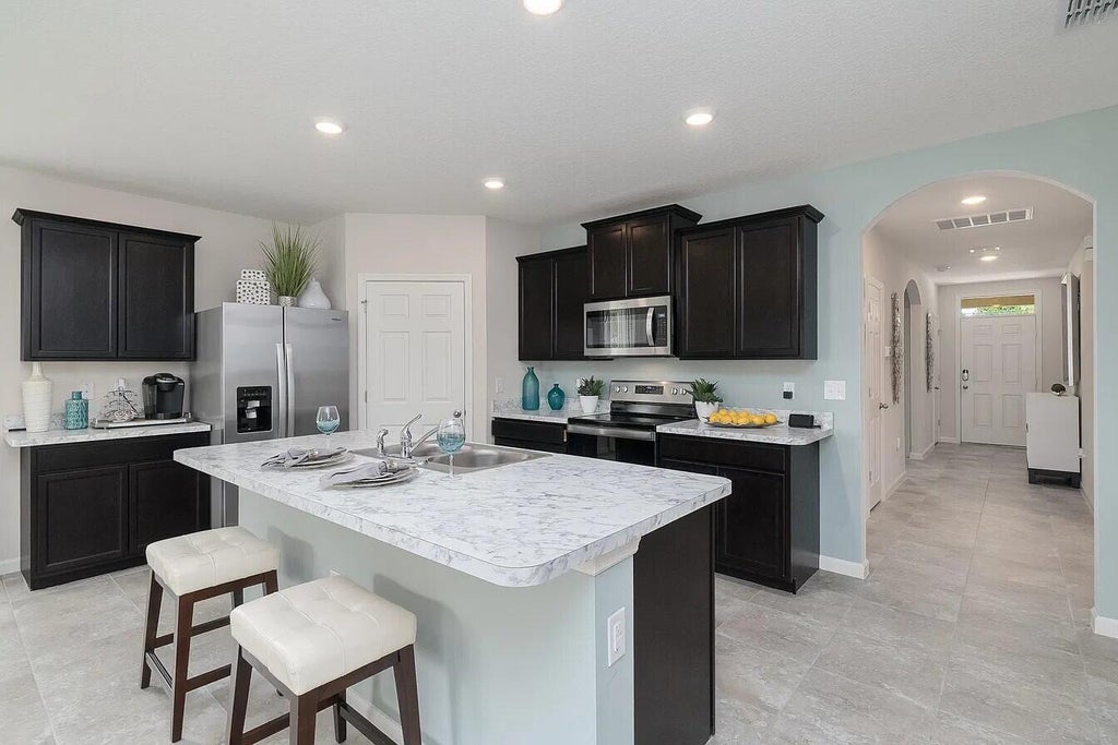 Photo of 1009 SW Dilido Lane, Port Saint Lucie, FL 34953 (MLS # B26091556)