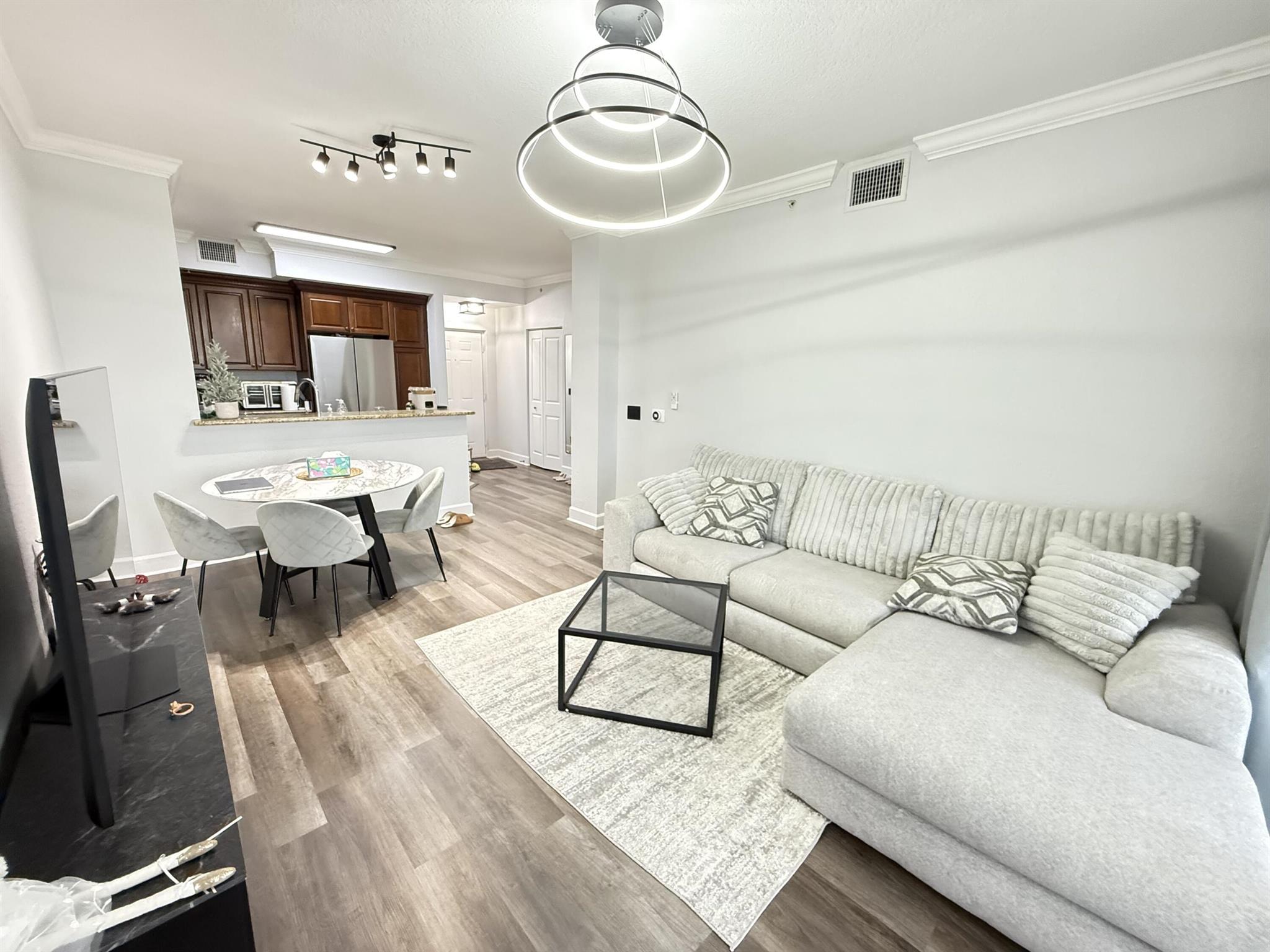 ONE OF A KIND MUST-SEE TOP FLOOR CORNER APARTMENT. Welcome to this beautifully updated 1-bedroom, 1-bathroom furnished apartment offering peace, privacy, and natural light with serene pool views. Freshly updated and thoughtfully maintained, it features a brand-new washer/dryer, refrigerator, dishwasher, and updated bathroom. Enjoy resort-style amenities including 3 swimming pools, a Jacuzzi, grill areas, a covered basketball court, a common lounge with billiards, and more. Perfectly located in downtown, just steps from shops and restaurants, this move-in-ready penthouse unit combines modern comfort with the convenience of vibrant city living. ONE OF A KIND MUST-SEE TOP FLOOR CORNER APARTMENT