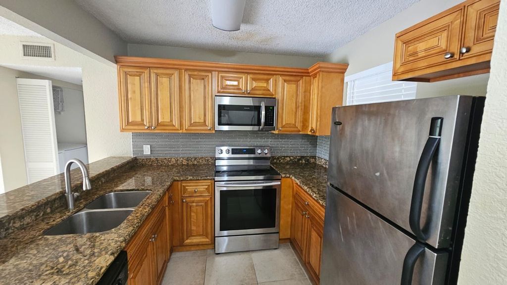 Photo of 1581 Balfour Point Drive #G, West Palm Beach, FL 33411 (MLS # B26019050)