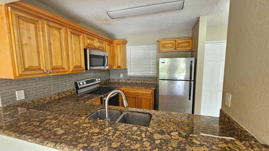 Photo of 1581 Balfour Point Drive #G, West Palm Beach, FL 33411 (MLS # B26019050)