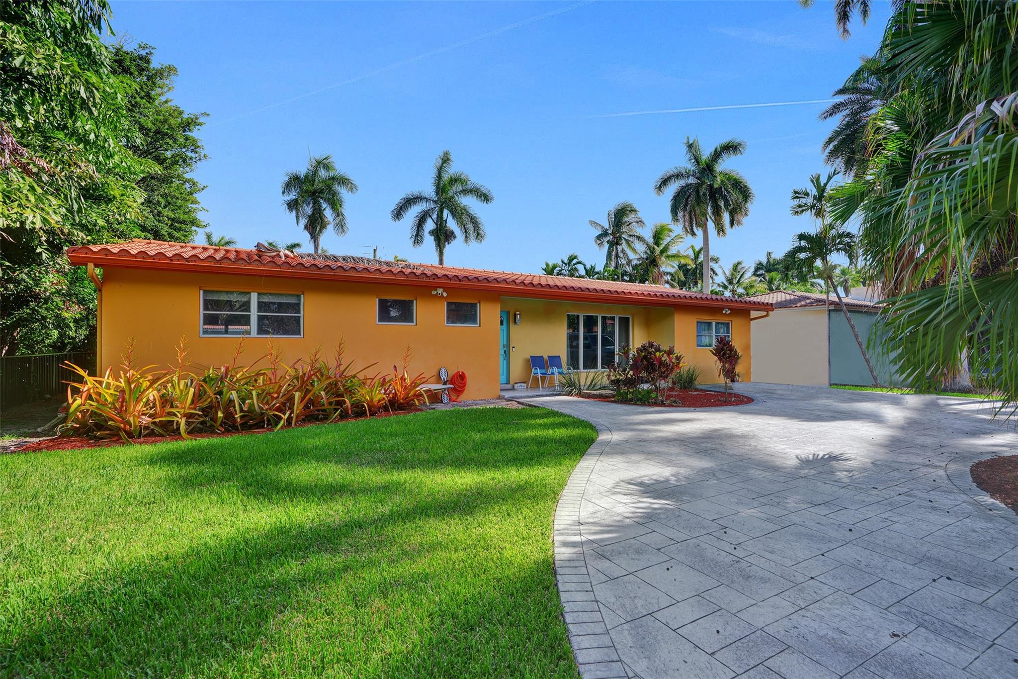 Elegant 3 bed / 3 bath home in the heart of Hollywood Lakes, just one block from scenic South Lake and minutes to the beach. Set on an expansive lot with plenty of room for a pool, this light-filled residence features bamboo flooring, spacious living areas, and a flexible in-law quarters setup. The gourmet kitchen is equipped with a premium Thermador cooktop, perfect for cooking and entertaining. A circular driveway offers ample parking, while the lush landscaping adds to the home’s charm and curb appeal. Ideally located near the beach, dining, shopping, and places of worship, this home combines comfort, style, and convenience in one of South Florida’s most desirable neighborhoods. A rare opportunity to own in a premier location just minutes from the best of Hollywood.