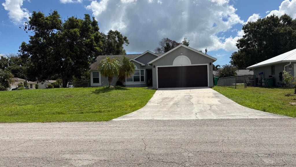 Photo of 1501 SW CURRY Street, Port Saint Lucie, FL 34983 (MLS # B26063994)