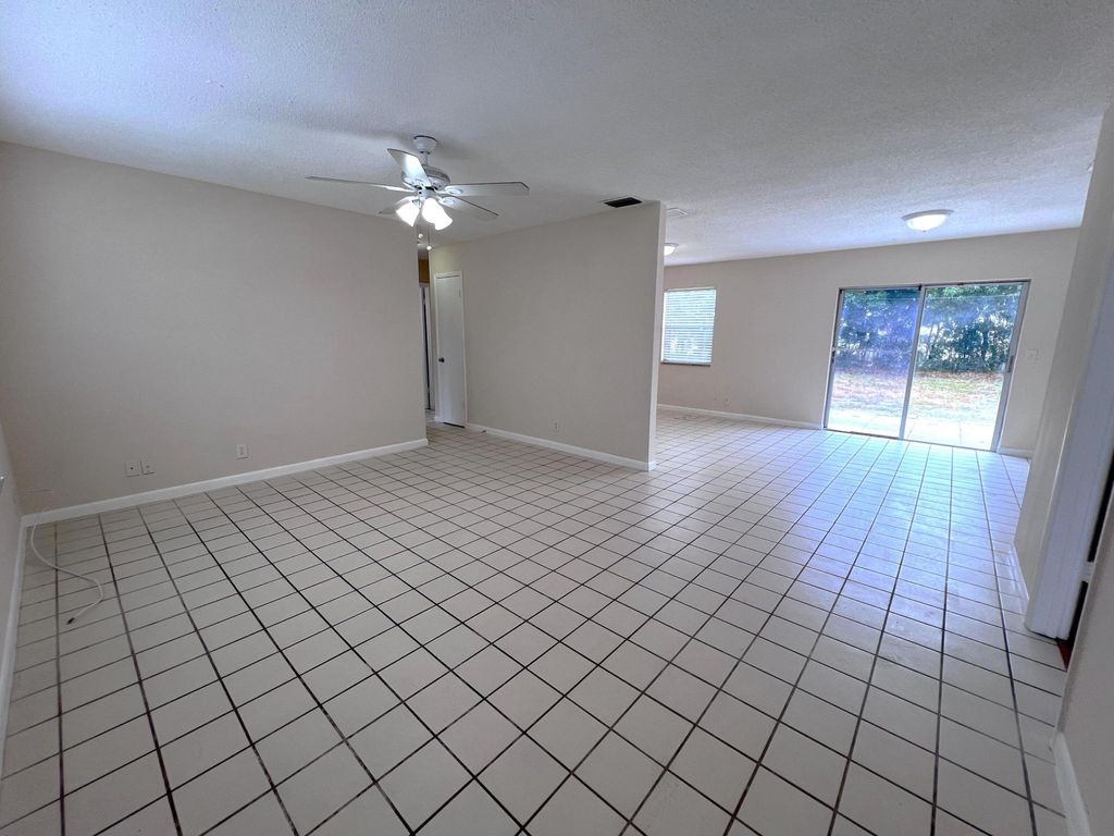 Photo of 644 Date Palm Drive, Lake Park, FL 33403 (MLS # R10984217)