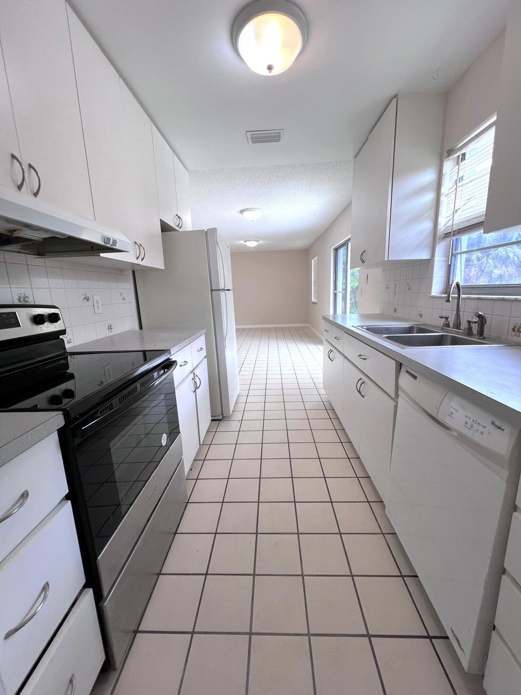 Photo of 644 Date Palm Drive, Lake Park, FL 33403 (MLS # R10984217)