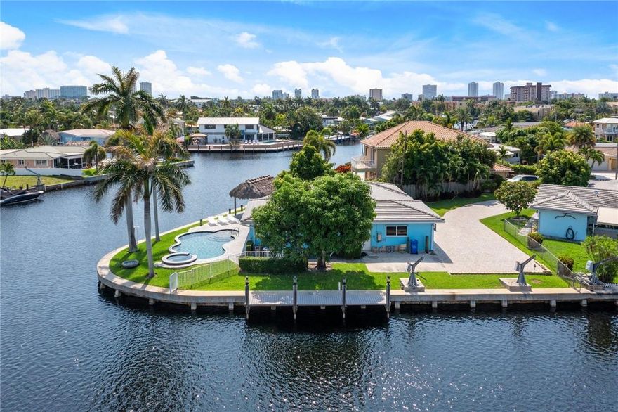 POINT LOT WITH 230 FT ON THE WATER. FABULOUS WATER VIEWS. HEATED POOL. THIS HOME IS GREAT FOR ENTERTAINING. TIKI HUT, FENCED IN BACKYARD THIS 3 BEDROOM AND 2 BATH HOME HAS A GREAT FLOOR PLAN. A/C WAS PUT IN 2013. ROOF IS ONLY 6 YEARS OLD. MOST OF THE WINDOWS AND DOORS ARE HURRICANE IMPACT. THIS IS A MUST SEE!