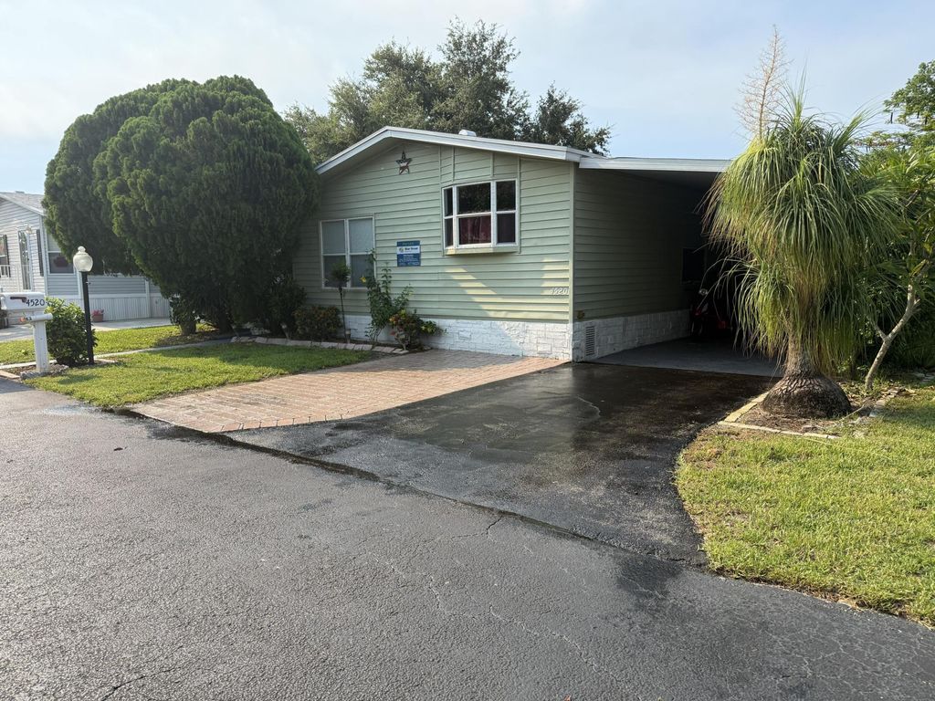 Photo of 4520 NW 68th Place, Coconut Creek, FL 33073 (MLS # B26044599)