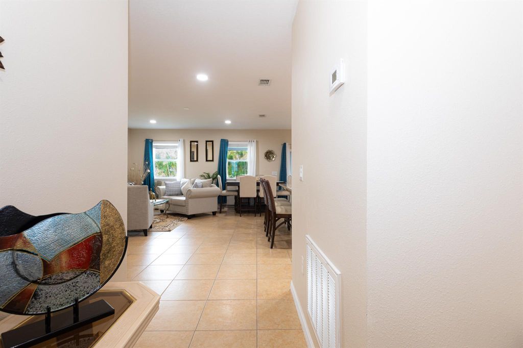 Photo of 701 SW Mccomb Avenue, Port Saint Lucie, FL 34953 (MLS # R11071327)