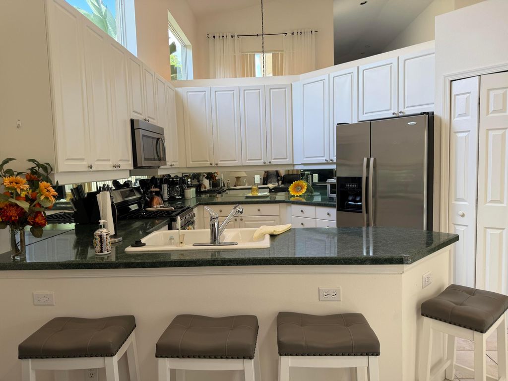 Photo of 324 Sunset Bay Lane, Palm Beach Gardens, FL 33418 (MLS # B26029851)