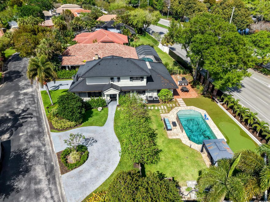 Gorgeous 4BR/3BA + den and custom office in gated Jacaranda Cove on rare .29-acre double lot. Updated kitchen with quartz counters, wood cabinetry & stainless steel appliances. Wood flooring throughout 1st floor and spacious vaulted-ceiling family room. Primary suite features large 12x10 custom walk-in closet, built-ins & spacious bath. Upstairs includes 3 bedrooms with Jack & Jill bath (dual shower/tub).Resort-style backyard with resurfaced pool, canopy cabana, gazebo, summer kitchen, outdoor lighting & speaker system, plus AstroTurf with putting green. Roof (2017), downstairs AC (2021), whole house generator, hurricane shutters/full protection, water filtration system, Nest smart AC, security cameras & alarm, renovated downstairs bath,  2-car garage+circular driveway. Must see!