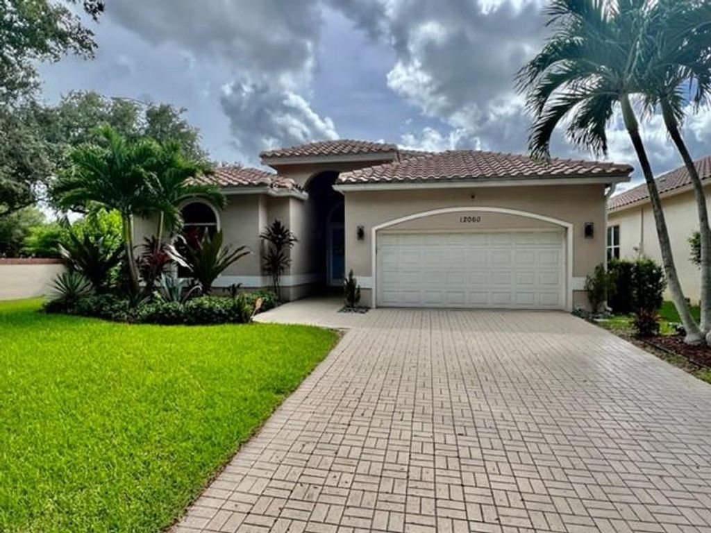 Photo of 12060 Glenmore Dr Dr, Coral Springs, FL 33071 (MLS # F10338438)