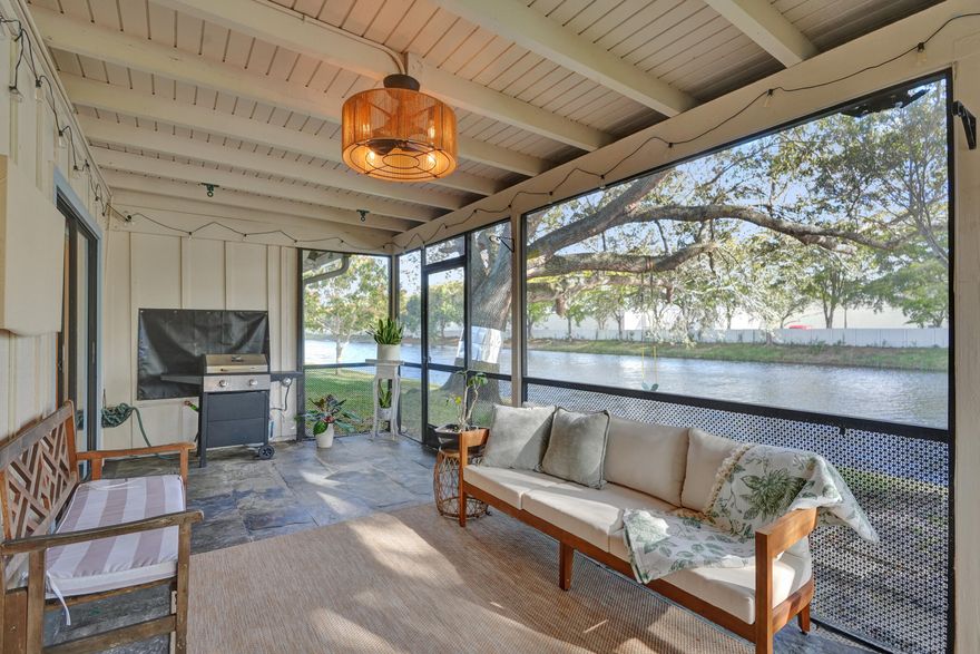 This meticulously maintained 3-bedroom waterfront townhome villa in the desirable Edgewater community of Tamarac offers comfort, style, and convenience. The residence features soaring vaulted ceilings and durable porcelain tile flooring throughout the main living areas, creating a bright and open feel. The updated kitchen showcases granite countertops, a marble backsplash, stainless steel appliances, and modern lighting. Step outside to a beautiful screened-in patio overlooking the water—perfect for tranquil evenings relaxing and enjoying the view. Residents enjoy a clubhouse and community pool with low HOA fees. FHA & VA approved and ideally located within walking distance to shops and restaurants with easy access to major roads.